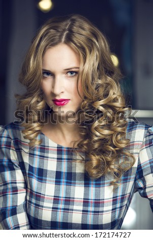 Beautiful woman with elegant hairstyle. Fashion photo
