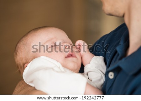 Happy Father with baby in his arms