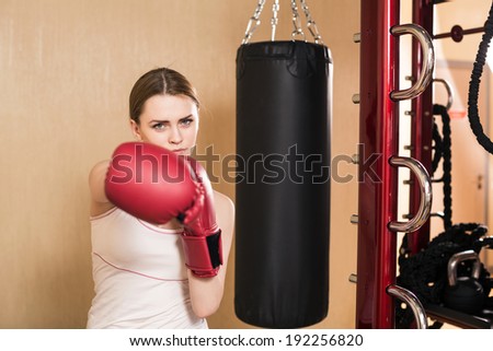 Photo of sexy woman in a gym club doing fit box