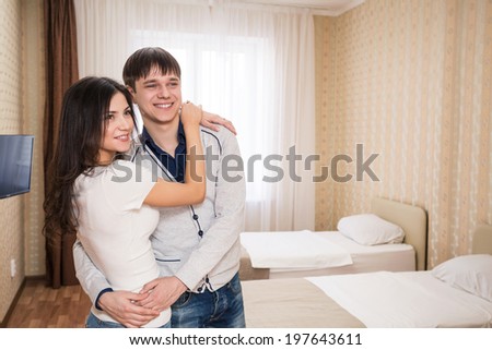 Young happy couple invite to bedroom