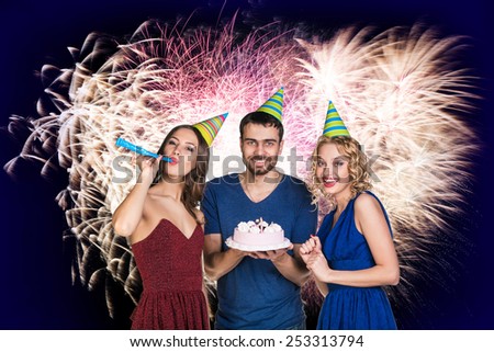 Young man celebrating birthday with friends