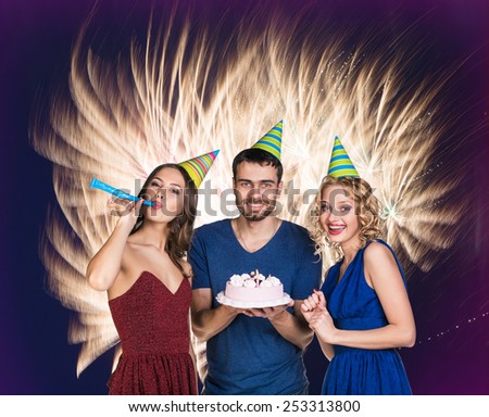 Young man celebrating birthday with friends