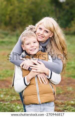 Happy mother hugging her little son. Family idyll concept