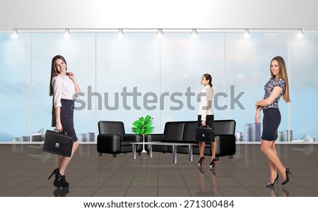 Younge people in the modern office with large windows