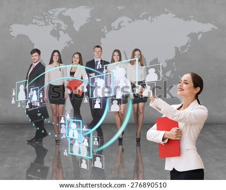 Interface business office of the future, a woman in office with map on background pushing on virtual buttons