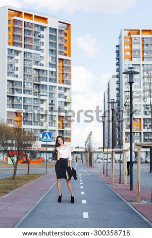 Business people walking along buildings in the residential district
