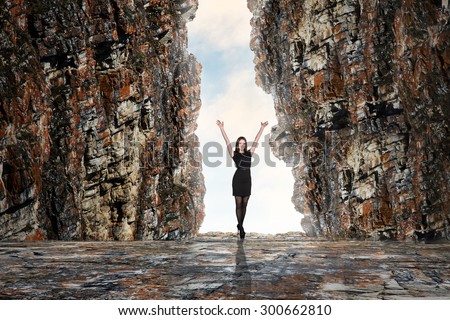 Business person looking at the end of the cave