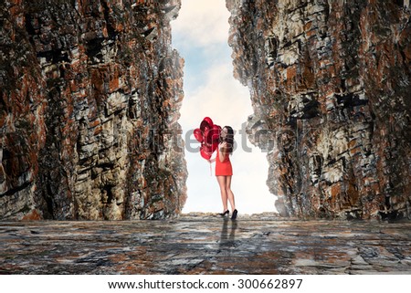 Woman looking at the end of the cave