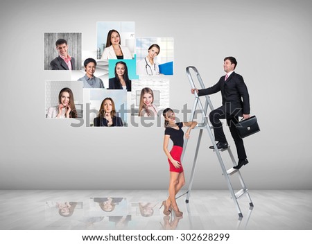 Businessman with woman assistant climbing a ladder with motivation background