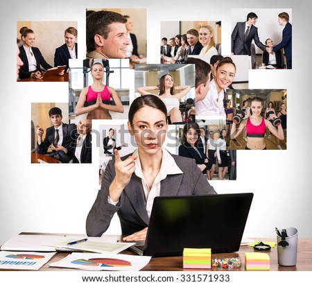 Young pretty business woman wags one\'s finger in the office and collage on the wall