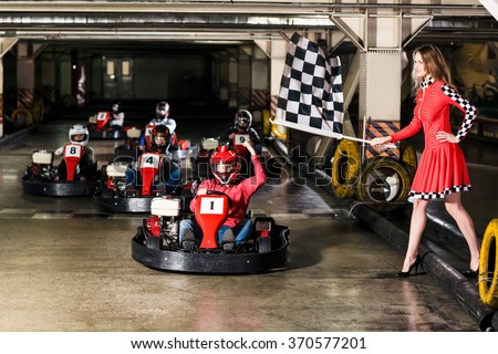 Group of people is driving go-kart car