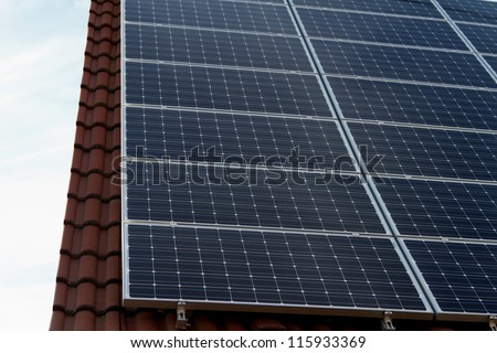 Shot of solar power photovoltaic energy panels fitted to house roof