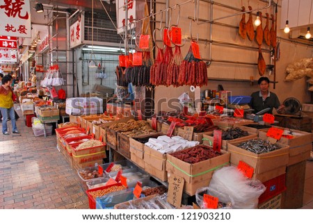 HONG KONG, CHINA-MAY23: Shoppers at Sheung Wan market dry fish shops in Des Voeux Road. These shops are a city landmark and operate since the 19th century. May 23, 2007 in Hong Kong China