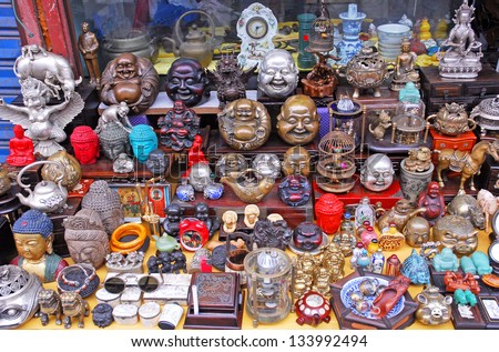 SHANGHAI, CHINA-MAY 4: Dongtai Lu Antique Market Buddha faces on sale. The market is great for mementos and souvenirs of Shanghai. May 4, 2007 Shanghai, China