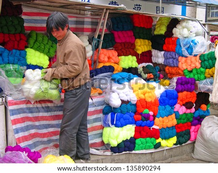 LHASA, TIBET-NOVEMBER 13: wool vendor in Barkhor Street. The ancient street is a symbol of Lhasa and a must see place for visitors. November 13, 2004 in Lhasa, Tibet