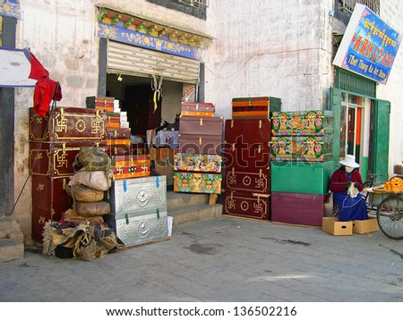 LHASA, TIBET-NOVEMBER 13: typical Tibetan box shop near Barkhor Street. The ancient street is a symbol of Lhasa and a must see place for visitors. November 13, 2004 in Lhasa, Tibet