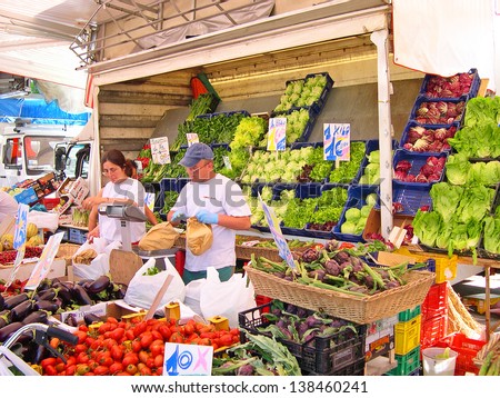 RAVENNA, ITALY MAY 21: vegetables vendor at the Wednesday outdoor market. The place is very popular in the city and attracts thousands of people. May 21, 2005 Ravenna Italy