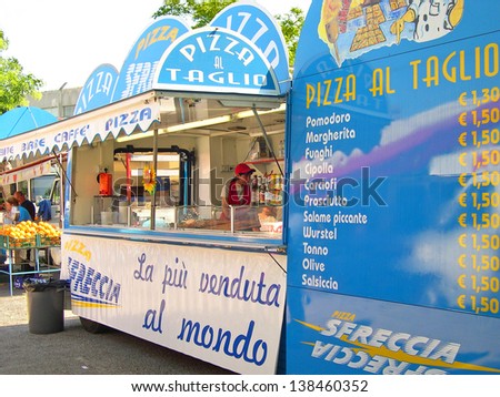 RAVENNA, ITALY MAY 21: pizza stands at the Wednesday outdoor market. The place is very popular in the city and attracts thousands of people. May 21, 2005 Ravenna Italy pizza shop