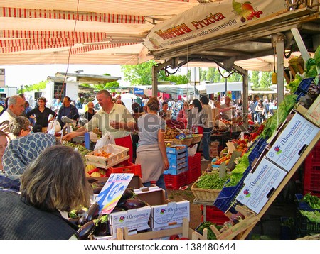RAVENNA, ITALY MAY 21: locals and tourists at the Wednesday outdoor market. The place is very popular in the city and attracts thousands of people. May 21, 2005 Ravenna Italy