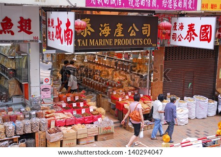 HONGKONG, CHINA-MAY 23: Shoppers in the dry food shops street, a city landmark. More than 300 seafood shops in Sheung Wan are famous for operating  since 19th century. May 23, 2007 Hong Kong, China