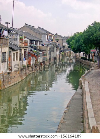LUZHI, SHANGHAI, CHINA -Â?Â? OCTOBER 30: typical village water way. The ancient village is a Shanghai tourist attraction with 100000 visitors per year. October 30, 2004 Luzhi, China.