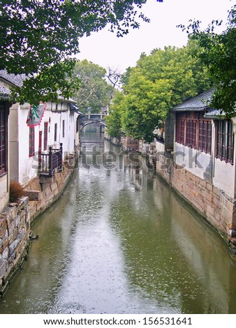 JINXI, SHANGHAI, CHINA  FEBRUARY 6: raining on a typical village water way. The ancient village is a Shanghai tourist attraction with 100000 visitors per year. February 6, 2005, Jinxi, China