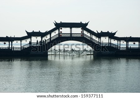 JINXI, SHANGHAI, CHINA - DECEMBER 8: the antique Wenchang Pavilion to the old village at dusk. The village is a Shanghai tourist attraction with 100000 visitors year. December 8, 2008, Jinxi, China