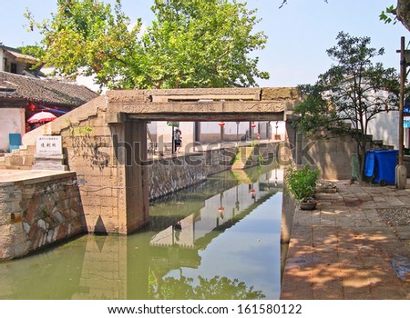 NANXUN, SHANGHAI, CHINA Ã¢Â?Â? AUGUST 28: one of the many village ancient bridges. The Nanxun water village is Shanghai tourist attraction with 100000 visitors year. August 28, 2004,Nanxun, China