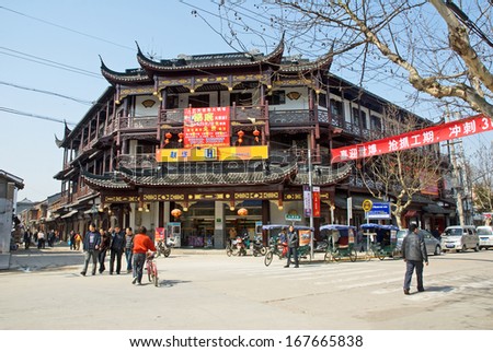 FENGJING, SHANGHAI, CHINA - MARCH 17:  locals and tourists in the village main street. The village is a Shanghai tourist attraction with 100000 visitors per year. March 17, 2010, Fengjing, China