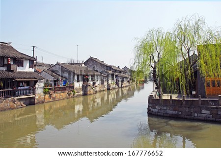 FENGJING, SHANGHAI, CHINA -Â?Â? MARCH 17: old houses along the main waterway. The ancient village is a Shanghai tourist attraction with 100000 visitors per year. March 17, 2010, Fengjing, China.
