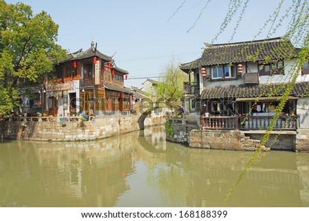 FENGJING, SHANGHAI, CHINA - MARCH 17: famous village spot named three bridges. The ancient village is a Shanghai tourist attraction with 100,000 visitors per year. March 17, 2010, Fengjing, China