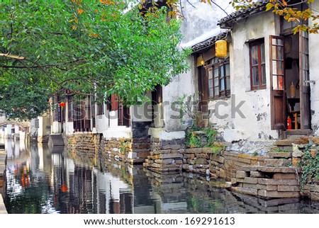 Zhouzhuang, a Shanghai tourist attraction. Old houses reflection in a village canal.