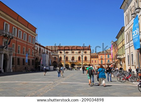 RAVENNA, ITALY- MAY 27, 2013: tourists and locals in People square. The city defined by UNESCO heritage of humanity has 3 million tourists per year