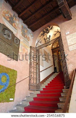 RAVENNA, ITALY- SEPTEMBER 9, 2014: old city council building entrance in People square. The city defined by UNESCO heritage of humanity has 3 million tourists per year.