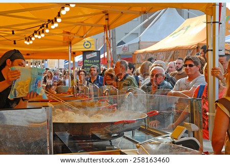 CERVIA, ITALY-SEPTEMBER 21, 2014: Spanish paiella stand at the annual International food outdoor market. This market is very popular and attract thousands of tourists.