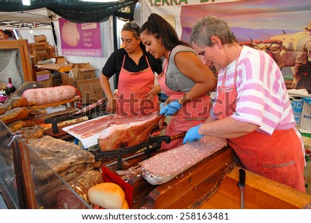 CERVIA, ITALY-SEPTEMBER 21, 2014: ham at the Tuscany  stand at the annual International food outdoor market. This market is very popular and attract thousands of tourists.