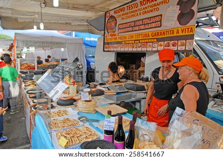 CERVIA, ITALY-SEPTEMBER 21, 2014: cooking plates  stand at the annual International food outdoor market. This market is very popular and attract thousands of tourists.