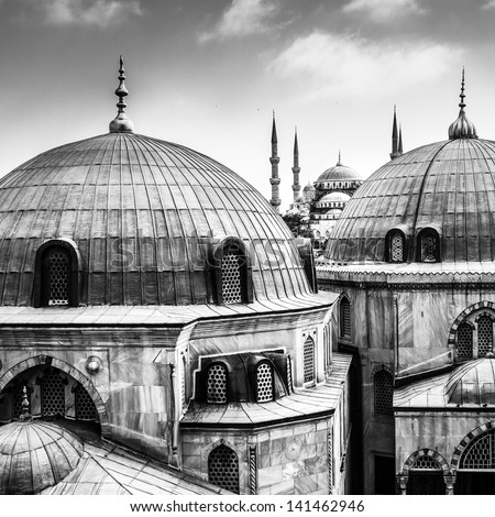 Blue Mosque Or Sultan Ahmed Mosque Viewed Trough The Window Of Hagia Sophia, Former Orthodox Patriarchal Basilica (Church), Later A Mosque, And Now A Museum In Istanbul, Turkey. Black And White.