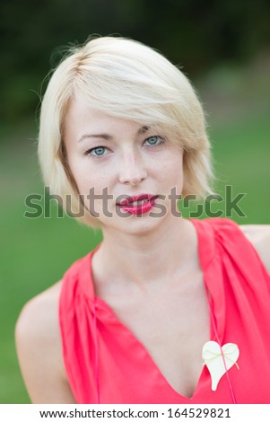 Portrait of a self-confident wedding planner shot outside,  in a garden.