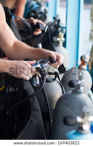 Dive master checking the diving equipment.