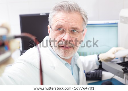 Life science researcher  performing a genotyping testing which enables personalized medicine. PM is a medical model that proposes the customization of health care.