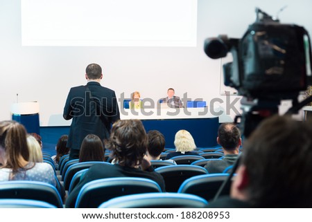 Business Conference and Presentation. Audience at the conference hall. Television broadcasted press conference.