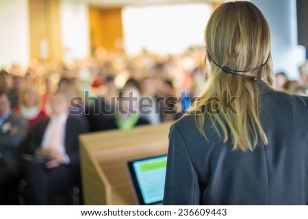 Female speaker at Business Conference and Presentation. Audience at the conference hall. Business and Entrepreneurship. Business woman.