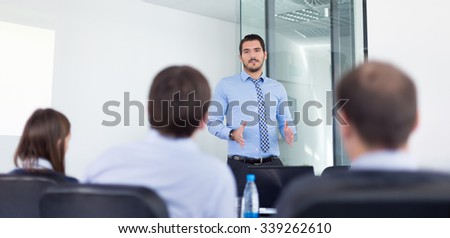 Business man making a presentation in office on job interview. Business presentation on corporate meeting. Recruiters evaluating the candidate.