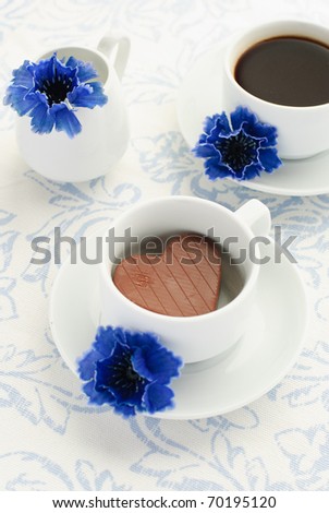 Valentine's day theme - Chocolate heart, cup of coffee and cornflowers
