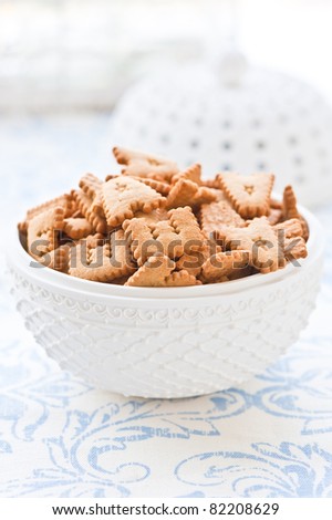 alphabet cookies in a white porcelain bowl