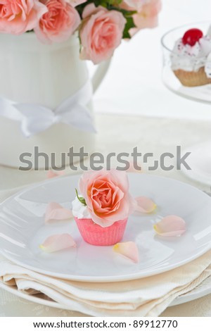 delicious cupcake white protein cream and a Bouquet of pink roses