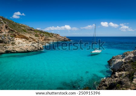 Sailing yacht stay in dream bay with turquoise transparent water. Mallorca island, Spain