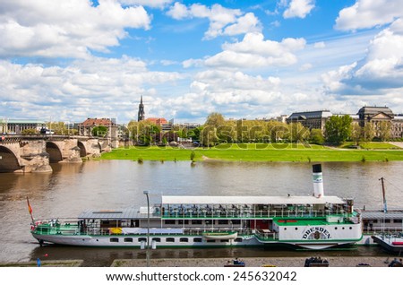 DRESDEN, GERMANY - MAY 12, 2013: Cityscape of old Dresden, Ferry on the Elbe River, Germany