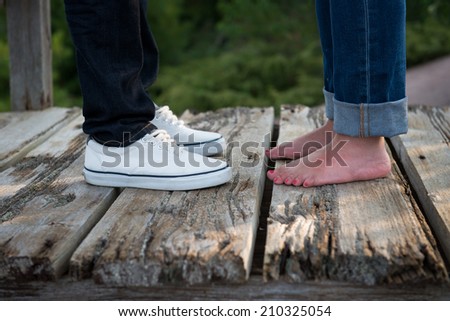Young couple in love put toes together